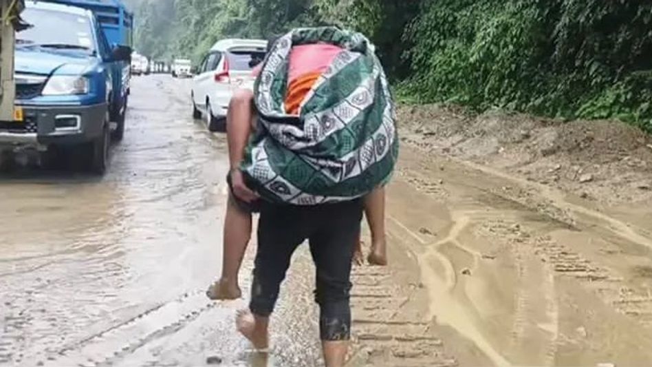 Arunachal: Army soldier carries patient to hospital on back in West Kameng district Arunachal: Army soldier carries patient to hospital on back in West Kameng district