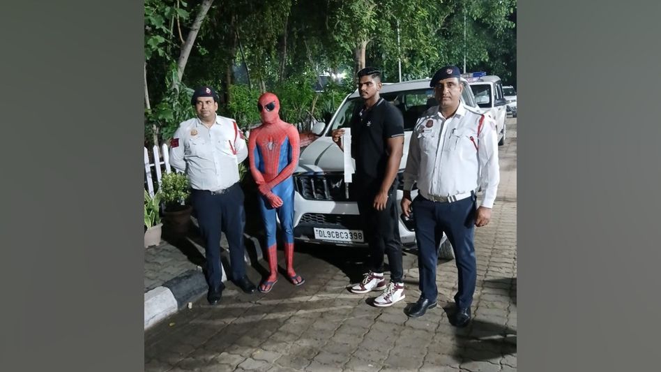 Delhi traffic police arrest man dressed as 'Spiderman' for clinging to car bonnet in Dwarka Delhi traffic police arrest man dressed as 'Spiderman' for clinging to car bonnet in Dwarka