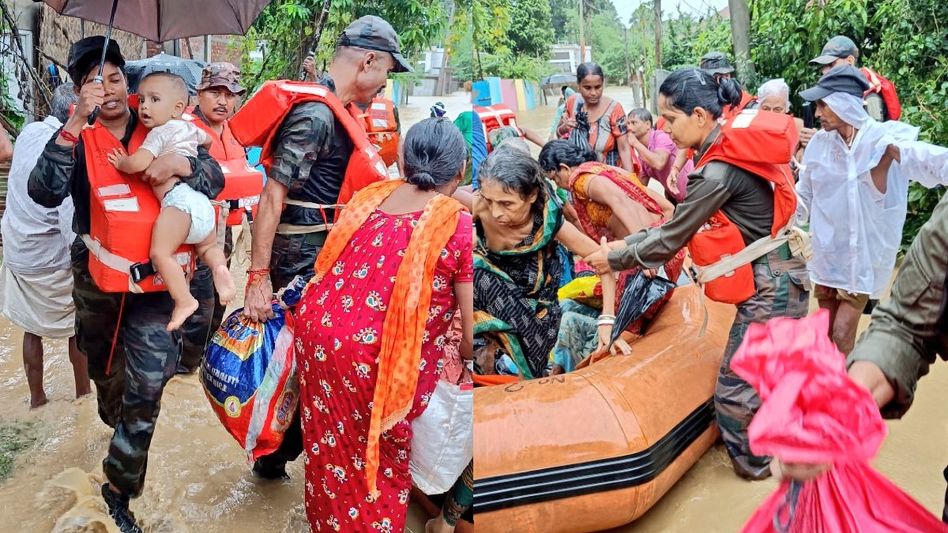 Riflewomen of Assam Rifles lead flood relief in Tripura, rescue stranded citizens Riflewomen of Assam Rifles lead flood relief in Tripura, rescue stranded citizens
