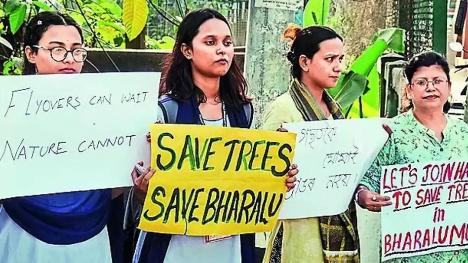 Assam: Residents in Guwahati form human chain to oppose tree felling for railway overbridge construction Assam: Residents in Guwahati form human chain to oppose tree felling for railway overbridge construction