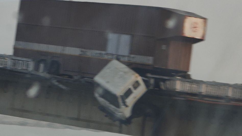 Assam: Container truck crashes into railing on Kaliabhomora bridge, narrow escape for driver Assam: Container truck crashes into railing on Kaliabhomora bridge, narrow escape for driver