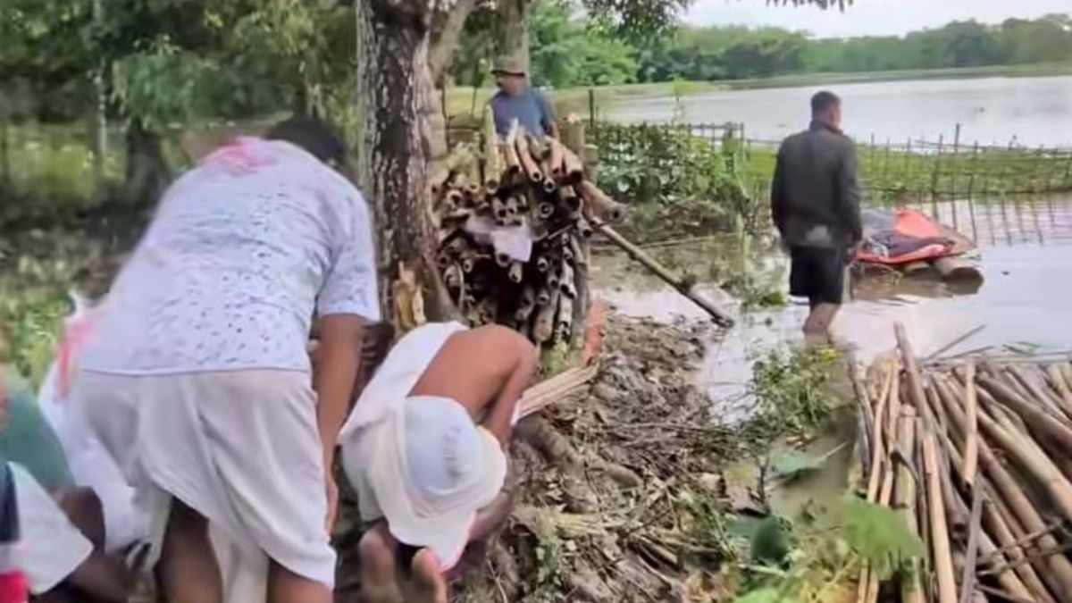 Assam floods: 106-year-old woman cremated on tiny patch of dry land in submerged Jorhat village