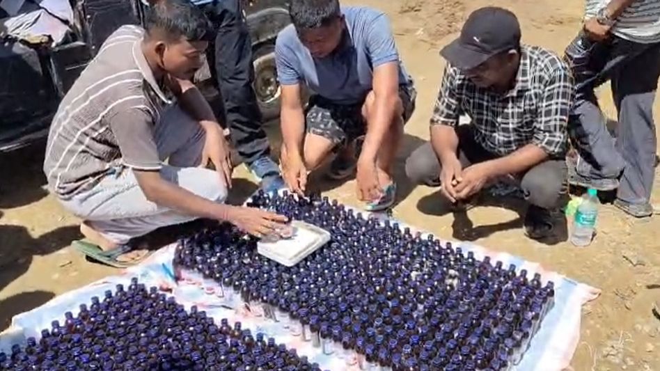 711 bottles of banned cough syrup seized from secret compartment of auto in Assam's Sribhumi, driver arrested 711 bottles of banned cough syrup seized from secret compartment of auto in Assam's Sribhumi, driver arrested