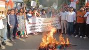 Protests erupt in Silchar over Bangladesh incident; BJP Yuva Morcha burns effigy Protests erupt in Silchar over Bangladesh incident; BJP Yuva Morcha burns effigy