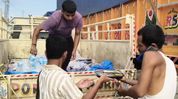 Assam's Ghumra police and journalists extend relief to hundreds of stranded truck drivers Assam's Ghumra police and journalists extend relief to hundreds of stranded truck drivers
