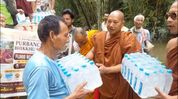 Buddhist monks' body distributes relief, Rs 1 lakh cash aid to flood-hit families in Assam Buddhist monks' body distributes relief, Rs 1 lakh cash aid to flood-hit families in Assam