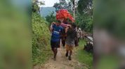 Ailing Manipur woman carried to Assam on bamboo stretcher amid road crisis Ailing Manipur woman carried to Assam on bamboo stretcher amid road crisis