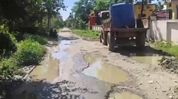 Assam: Tinsukia residents seek urgent repair of pothole-ridden road ahead of Durga Puja Assam: Tinsukia residents seek urgent repair of pothole-ridden road ahead of Durga Puja
