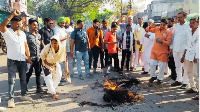 Farmers organization in support of wrestling players, demanding action by burning effigy