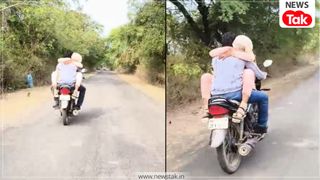 MP में प्रेमी जोड़े का जानलेवा स्टंट, चलती बाइक पर पेट्रोल टैंक पर बैठकर प्रेमिका ने डाली बाहें, वीडियो आया सामने NewsTak