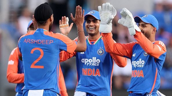 India's paceman Arshdeep Singh (L) celebrates his wicket