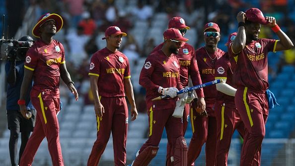 Shai Hope (3R) and teammates of West Indies celebrate winning