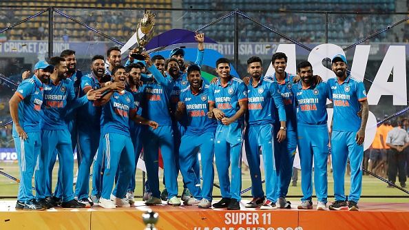 India's players celebrate with the trophy after winning the during the Asia Cup