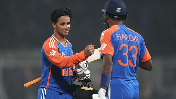 Abhishek Sharma of India interacts with teammate Hardik Pandya