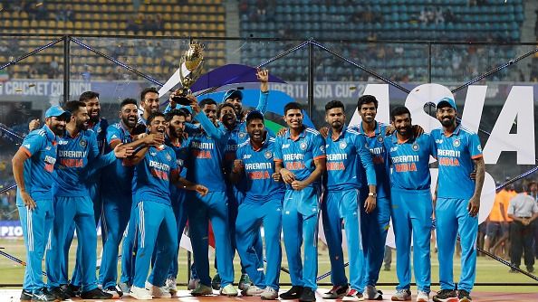 India's players celebrate with the trophy