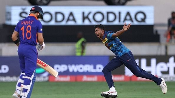 Sri Lanka's Dilshan Madushanka (R) celebrates after bowling out India's Virat Kohli=