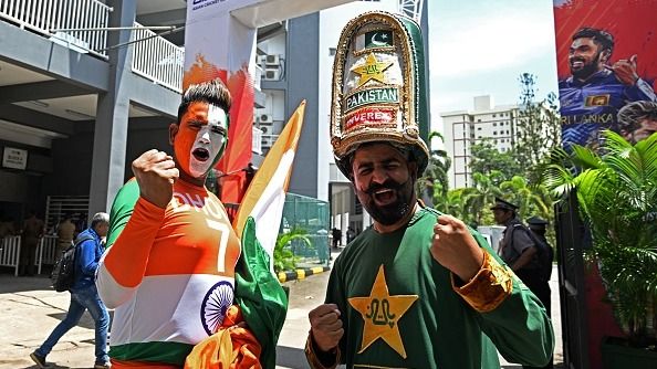 Fans cheer for India's and Pakistan's team as they arrive to watch the Asia Cup