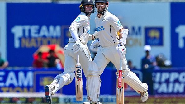 New Zealand's Kane Williamson (R) and Devon Conway run between the wickets during the third day of the second Test cricket match between Sri Lanka and New Zealand