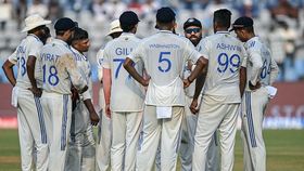 India's captain Rohit Sharma (3R) speaks to his teammates in a drinks break during the second day of the third and final Test cricket match between India and New Zealand India's captain Rohit Sharma (3R) speaks to his teammates in a drinks break during the second day of the third and final Test cricket match between India and New Zealand