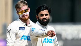New Zealand's Ajaz Patel (R) gestures as Glenn Phillips watches at the end of the third and final Test cricket match between India and New Zealand New Zealand's Ajaz Patel (R) gestures as Glenn Phillips watches at the end of the third and final Test cricket match between India and New Zealand