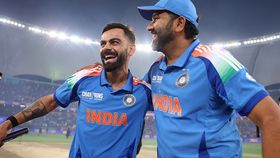 Virat Kohli of India and teammate Rohit Sharma celebrate following the team's victory Virat Kohli of India and teammate Rohit Sharma celebrate following the team's victory