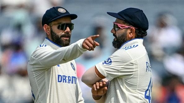 India's Virat Kohli talks with his captain Rohit Sharma in this frame