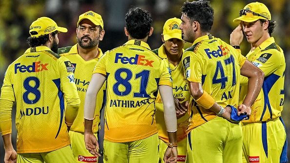 Chennai Super Kings' captain MS Dhoni (2L) celebrates with teammates in this frame