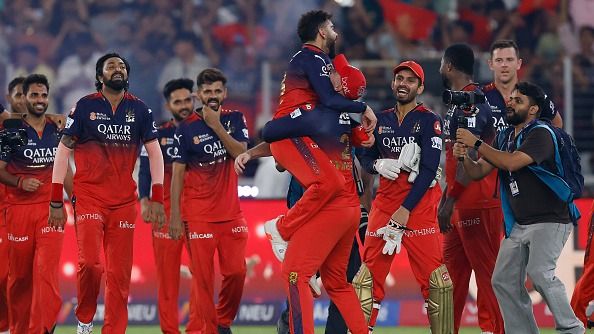 Liam Livingstone of Royal Challengers Bengaluru celebrates with teammate Virat Kohli after winning the 2025 IPL Final match