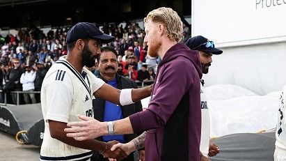 Ben Stokes (R) shakes hands with Jasprit Bumrah