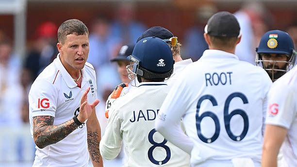 Brydon Carse of England and Ravindra Jadeja of India