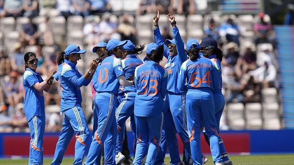 India players celebrate after England's Tammy Beaumont 