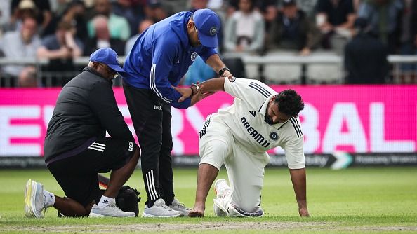 India's Rishabh Pant reacts as he receives medical attention following a foot injury while playing on day one of the fourth cricket test match between England and India at Old Trafford, in Manchester, north England, on July 23, 2025.