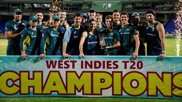 Australia's players celebrate with the trophy