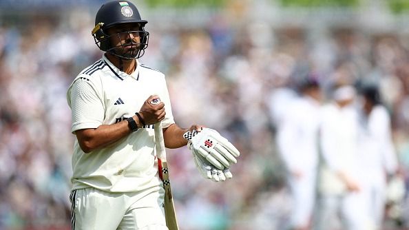 Karun Nair reacts as he walks back to the pavilion after losing his wicket