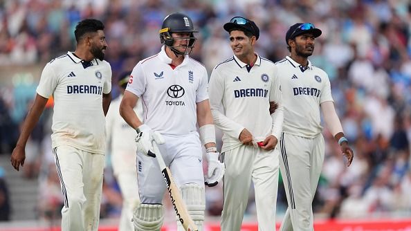 Jamie Smith (second left) leaves the field with India's Mohammed Sirajand (left) and Shubman Gill (second right) due to rain