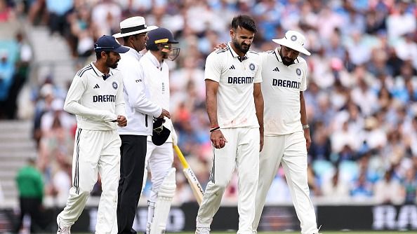India's Akash Deep (2R) reacts after being hit on the leg