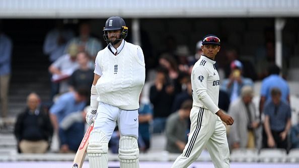 Chris Woakes of England walks out to bat with his left armृ