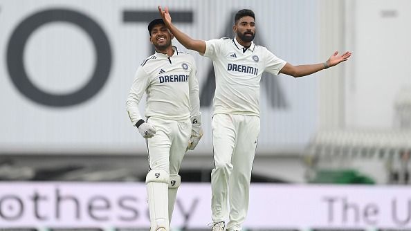 Dhruv Jurel (L) and Mohammed Siraj celebrate after India won the fifth Rothesay Test Match