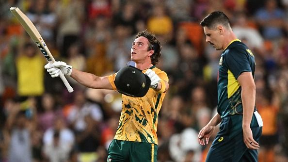 South Africa's batsman Dewald Brevis (L) celebrates scoring his century