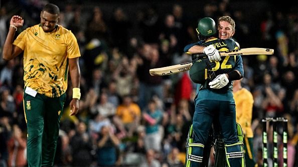 Australia's Glenn Maxwell (C) and Adam Zampa (R) celebrate their team's victory