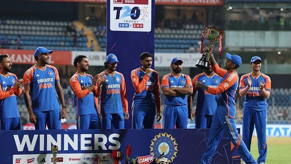 Suryakumar Yadav of India brings the IDFC First Bank T20 Trophy to the players