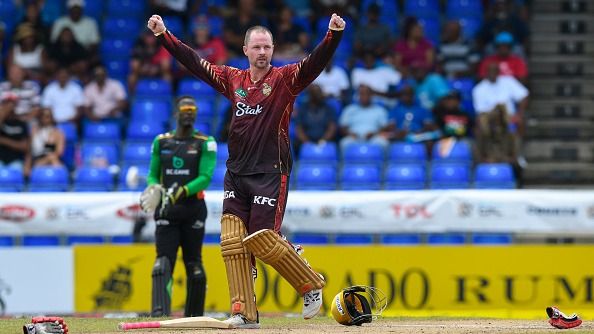 Colin Munro celebrates his century