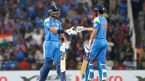 Shubman Gill of India celebrates after scoring a fifty (50 runs) with Axar Patel