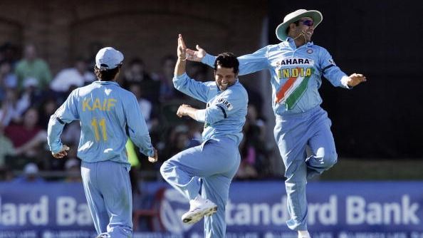 Indian bowler Sachin Tendulkar (C) celebrates with Indian captain Virender Sehwag