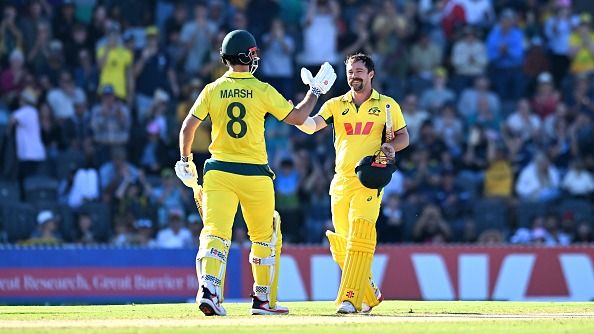 Travis Head of Australia celebrates with Mitchell Marsh his century