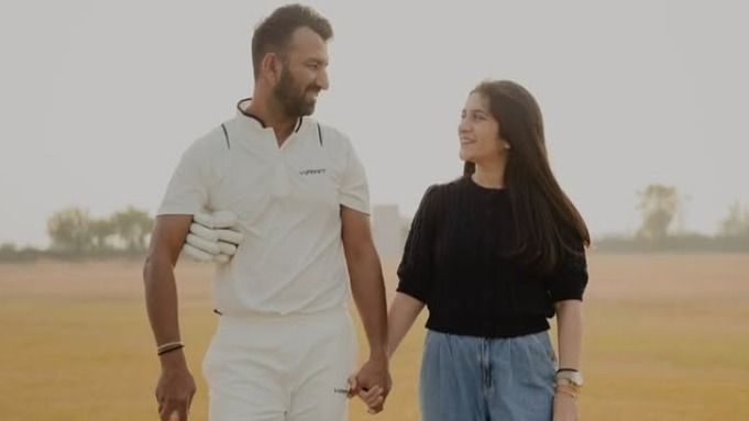 Cheteshwar Pujara with his wife Puja