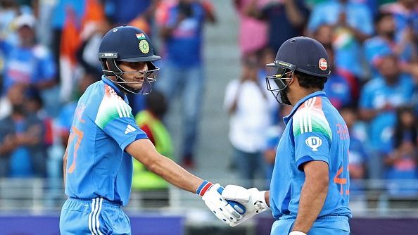 India's Shubman Gill (L) congratulates his team captain Rohit Sharma
