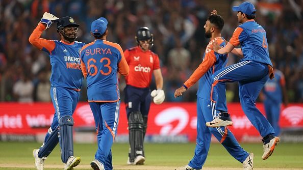 India's Varun Chakravarthy (2nd from right) celebrates with his teammates in this frame