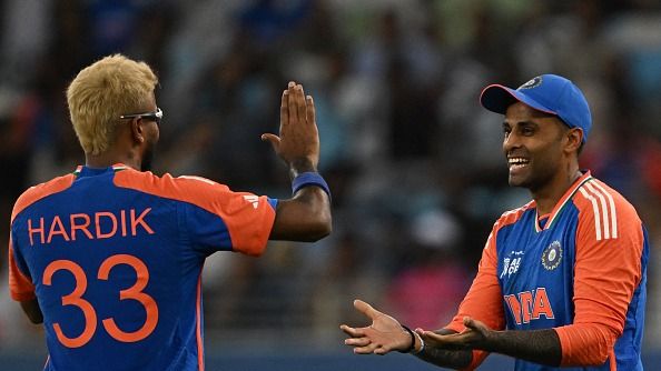India's captain Suryakumar Yadav (R) celebrates with his teammate Hardik Pandya