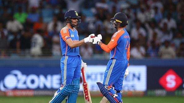 Shubman Gill (L)speaks to Abhishek Sharma